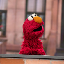 elmo behind a wall