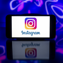 In this photo illustration, an Instagram logo is seen displayed on a mobile phone screen.