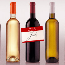 stock image of wine bottles with name tagging saying "hi my name is josh"