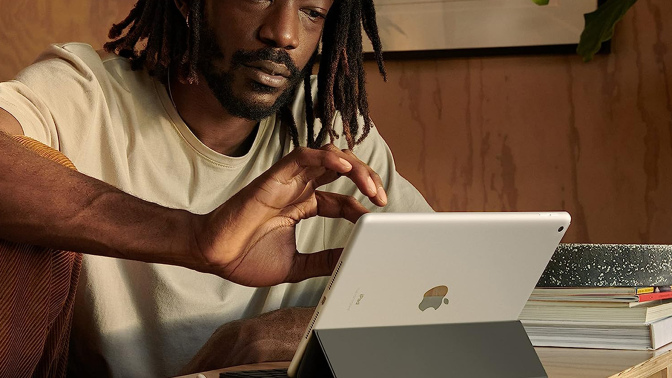 black man using Apple iPad 9th Gen