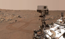 NASA's Perseverance rover, with tracks in the background, exploring the Martian desert.