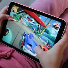 Child playing a racing game on iPad mini 5