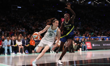 Breanna Stewart #30 of the New York Liberty in action against Awak Kuier #28 of the Dallas Wings