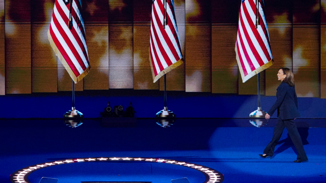 Kamala Harris strides on to the DNC stage.