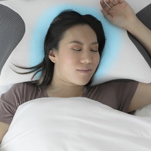 Person using the Carbon SnoreX™ Cooling Pillow.