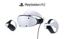 An angled front-facing photo of the PlayStation VR2 headset and its PS VR2 Sense controllers.