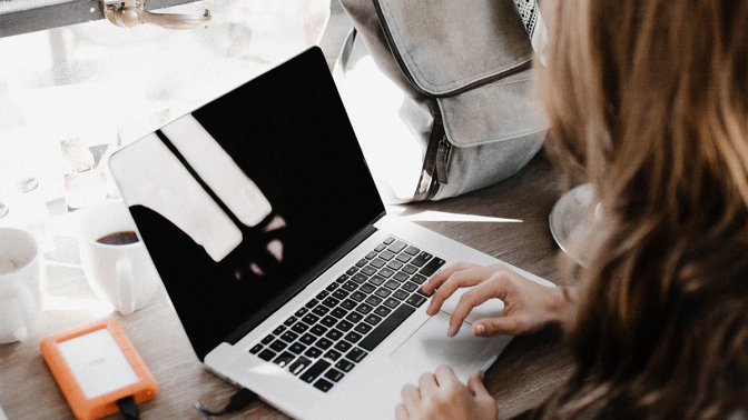 woman looking at laptop