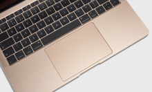 A rose gold 2018 Macbook that has the defective butterfly keyboard.