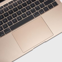 A rose gold 2018 Macbook that has the defective butterfly keyboard.