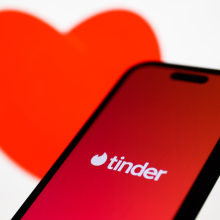 tinder on app with red heart background