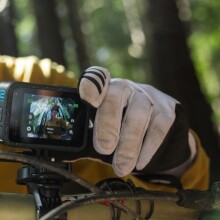 A GoPro Hero 12 camera is mounted on a mountain bike 