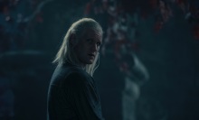 Daemon Targaryen stands beneath a weirwood tree at night.