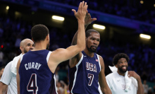 Kevin Durant of United States celebrates with Stephen Curry