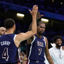 Kevin Durant of United States celebrates with Stephen Curry