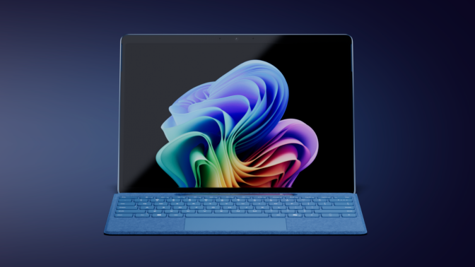 a microsoft surface pro 11 with a keyboard attached against a dark blue background