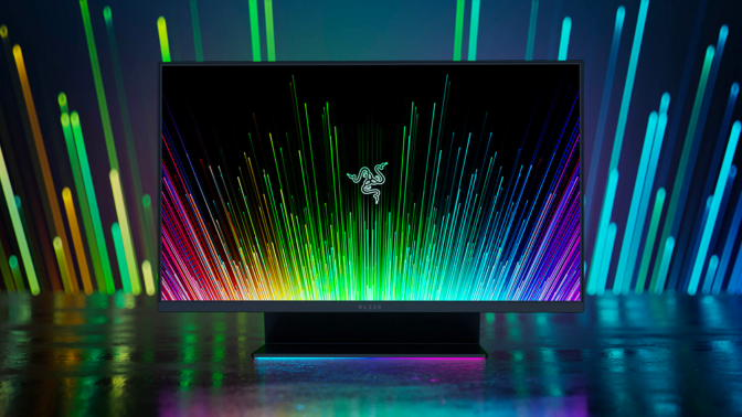 the razer raptor 27 against a shadowy rainbow background