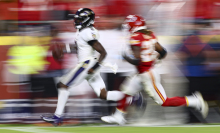 Lamar Jackson of the Baltimore Ravens carries the ball