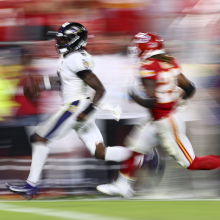 Lamar Jackson of the Baltimore Ravens carries the ball