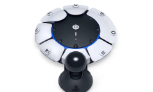 A Sony PlayStation accessible controller, which features a circular design with a joystick at the front.