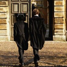 Pupils at Eton College hurry between lessons March 1, 2004 wearing the school uniform of tailcoats and starched collars, in Eton, England.