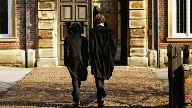 Pupils at Eton College hurry between lessons March 1, 2004 wearing the school uniform of tailcoats and starched collars, in Eton, England.