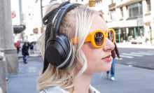 person wearing bose quietcomfort ultra headphones outside