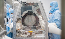 NASA scientists opening the OSIRIS-REx Asteroid Sample Return lid at the Johnson Space Center.