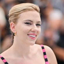 Scarlett Johansson smiles directly at the camera.