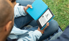 child holding kindle paperwhite kids e-reader