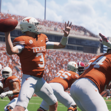 quaterback Quinn Ewers in burnt orange texas jersey throwing a football