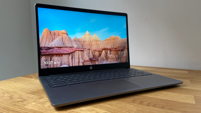 a side angled view of the hp chromebook plus 15.6-inch on a wooden table