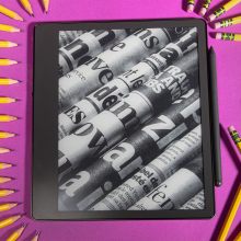 Kindle Scribe surrounded by writing utensils