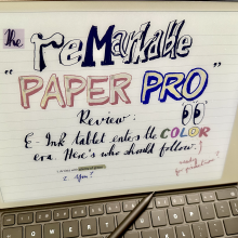 A Remarkable Paper Pro e-ink screen has a 'Remarkable Paper Pro' review written on it. 