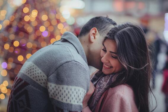 Two people kissing.