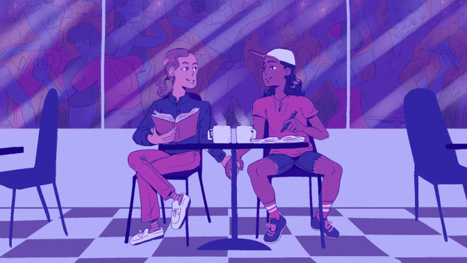 two people sitting in a coffee shop