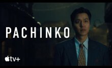 A man in a suit, with the title card "Pachinko" beside him.