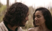 A man and woman gazing at each other in the trailer for "One Hundred Years of Solitude."