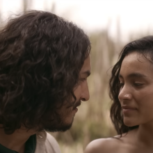 A man and woman gazing at each other in the trailer for "One Hundred Years of Solitude."