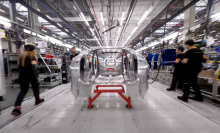 A flying view of a Tesla Gigafactory assembly line. 