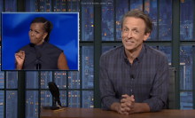 Seth Meyers presents "Late Night" beside a picture of Michelle Obama.