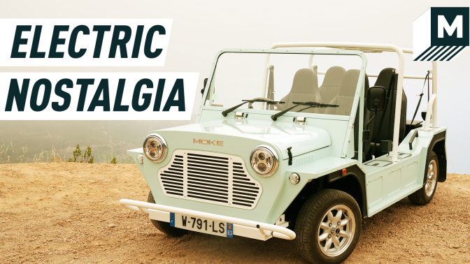 An image portraying a mint-coloured e-Moke parked on a cliff. Caption reads: "Electric Nostalgia"