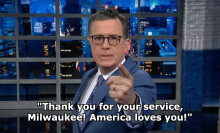 Stephen Colbert on 'The Late Show with Stephen Colbert.' Text on the image reads: "Thank you for your service, Milwaukee! America loves you!"