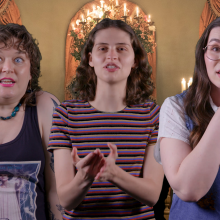 From left to right: Mashable staff Kristy Ouchko, Belen Edwards, and Lily Kartiganer smile and gesticulate against a 'Bridgerton' interior shot