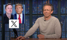 A man sits behind a talk show desk. In the top-left is an image of two other men.