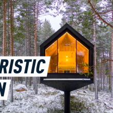 Futuristic cabin floats inside a Finnish forest