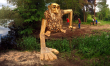 Artist builds gentle giants from scrap wood and hides them throughout his city