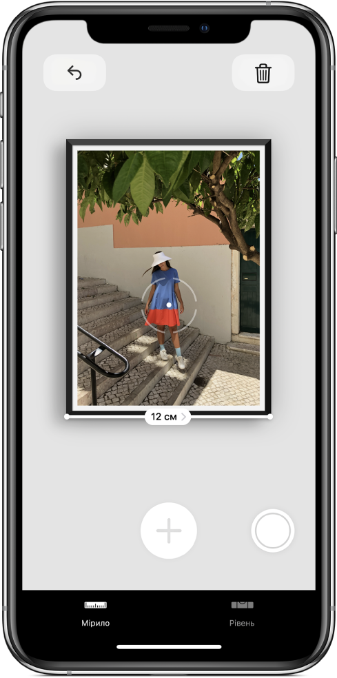 Вимірювання фотографії в рамці. Ширина відображається біля нижнього краю. Кнопка «Зробити знімок» розташована в правому нижньому куті.