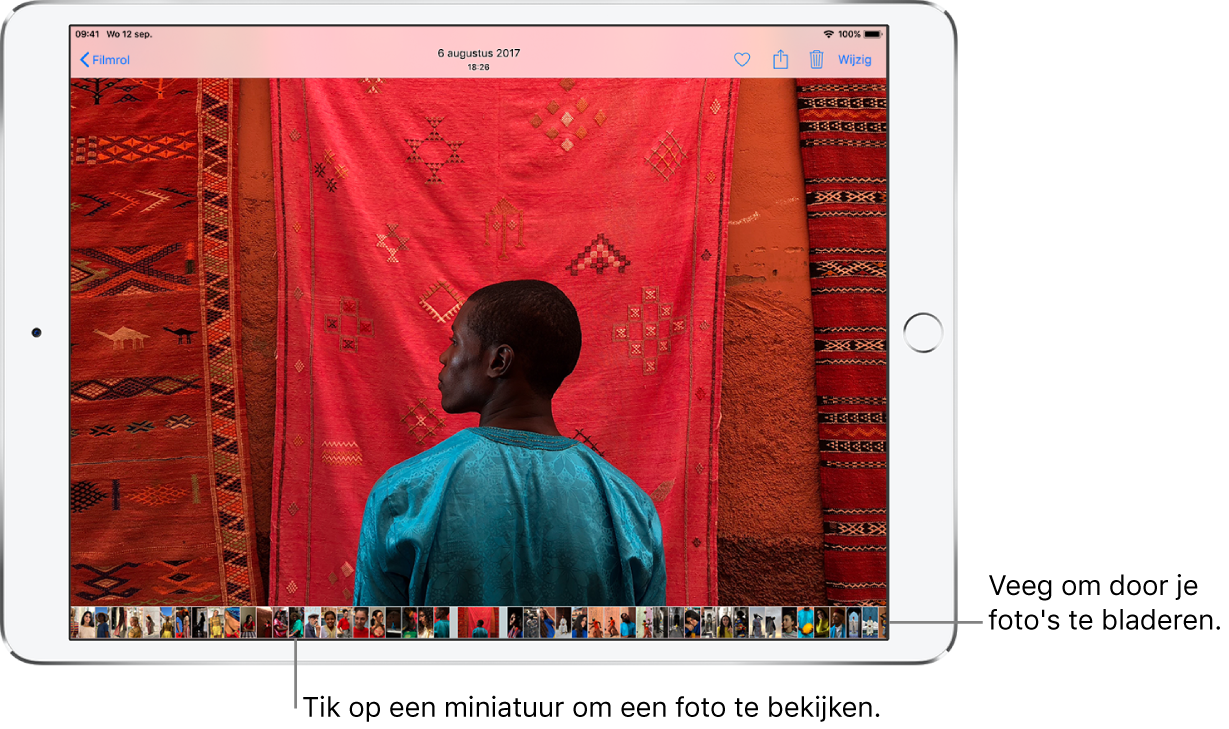 Een foto met miniaturen van andere foto's in de filmrol onder in het scherm. Linksbovenin staat de knop 'Filmrol', waarmee je naar het scherm 'Filmrol' teruggaat. Rechtsboven zie je de knoppen 'Leuk', 'Deel', 'Verwijder' en 'Wijzig'.