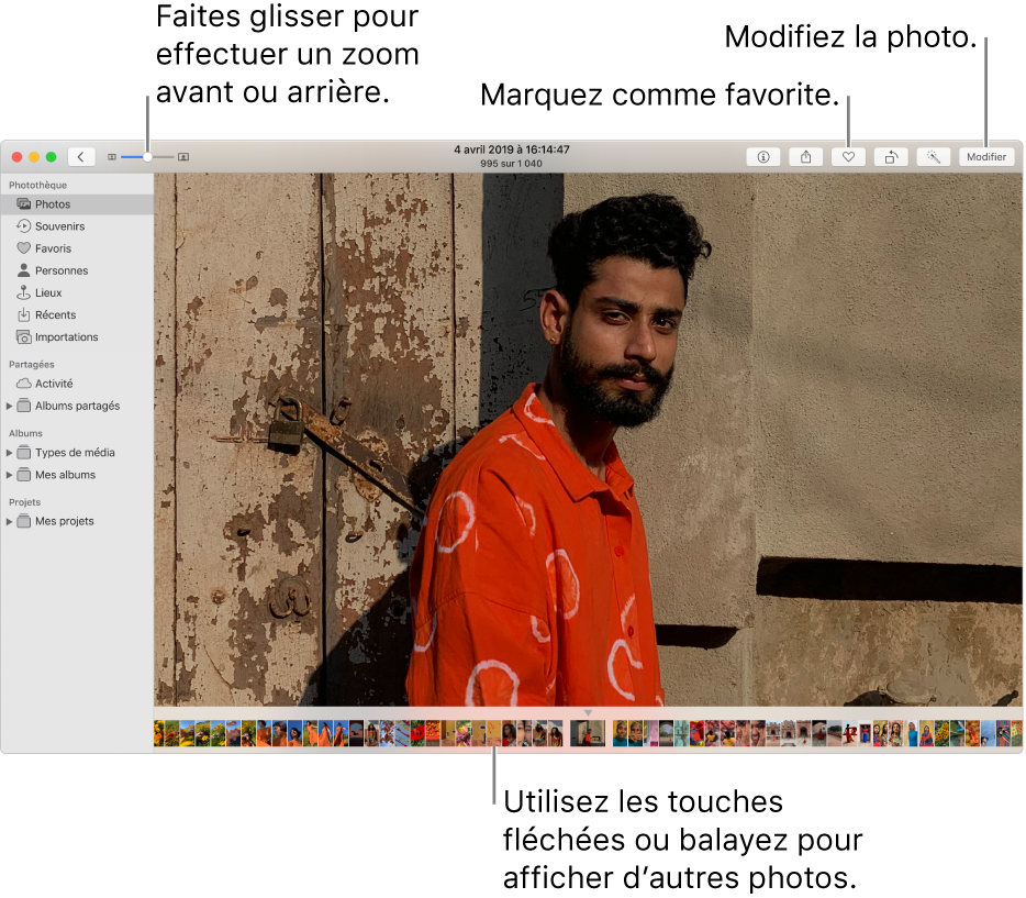 La fenêtre Photos affichant une photo élargie sur la droite avec une rangée de vignettes en dessous. La barre d’outils en haut inclut le curseur Zoom, le bouton Favori et le bouton Modifier.