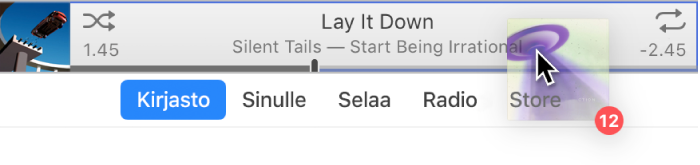 iTunes-ikkunan yläreunaan vedetty albumi.